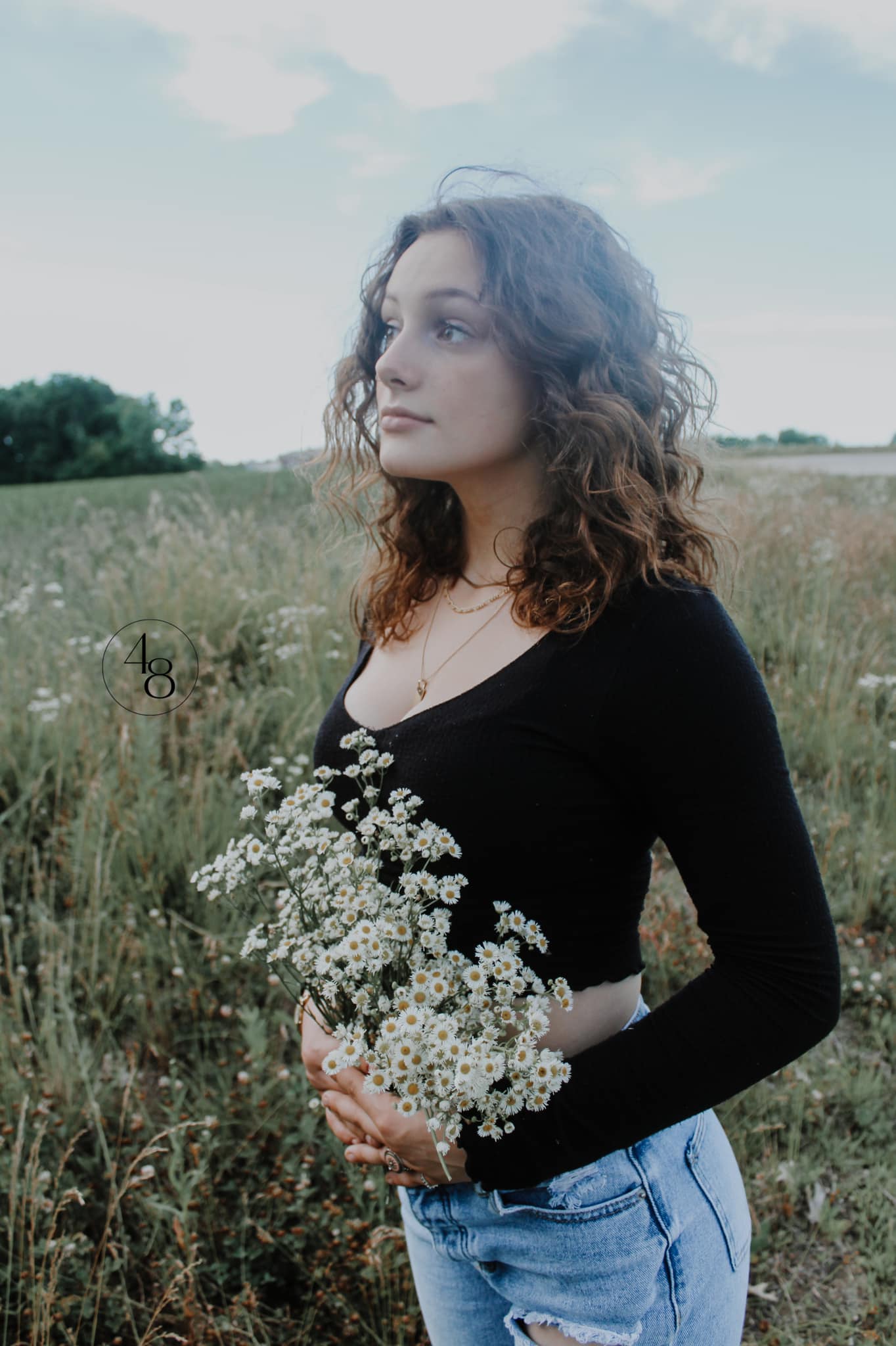 solo portrait, senior pictures, High school girl holding flowers in a field