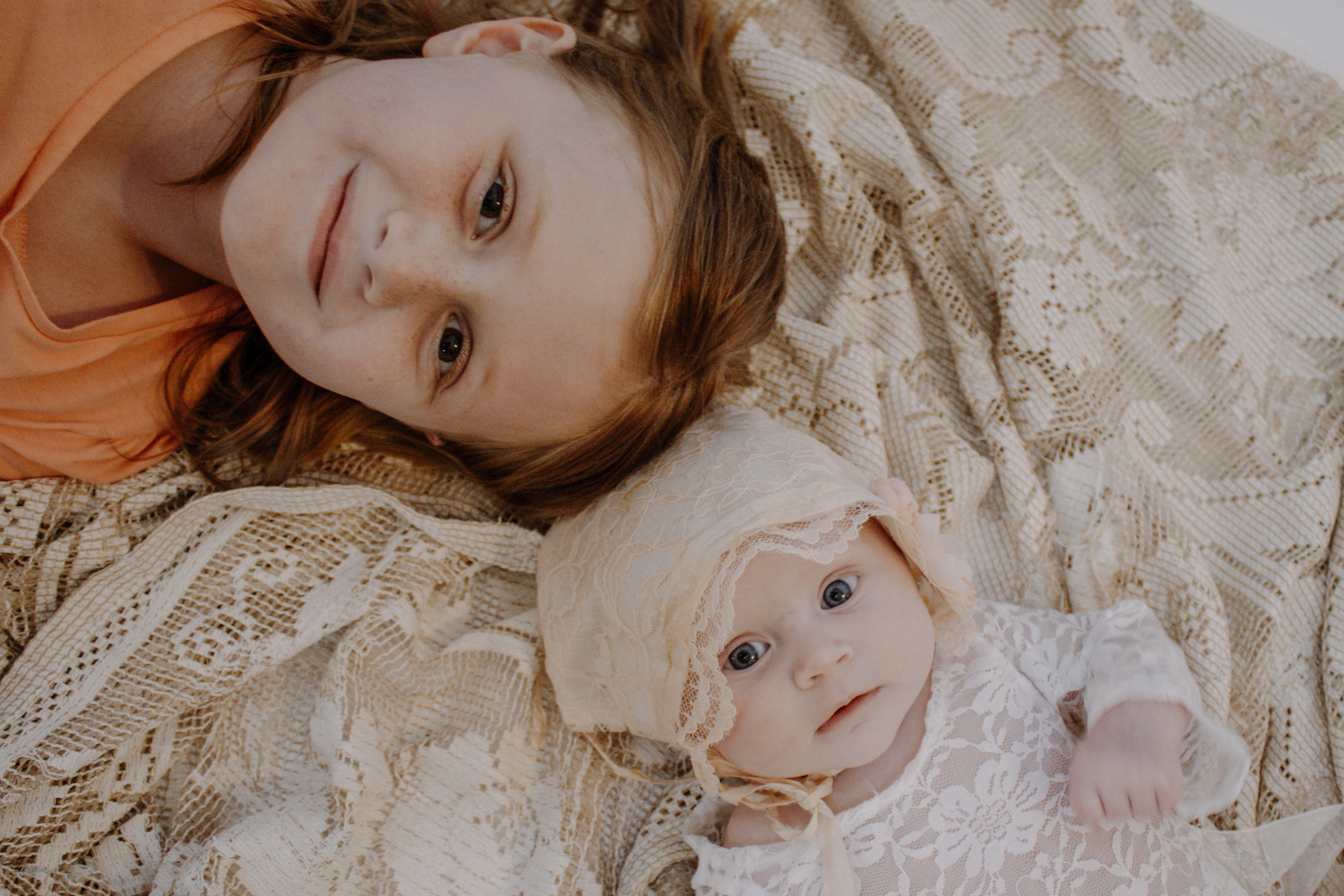 newborn photography, baby and sister, baby with sibling pose