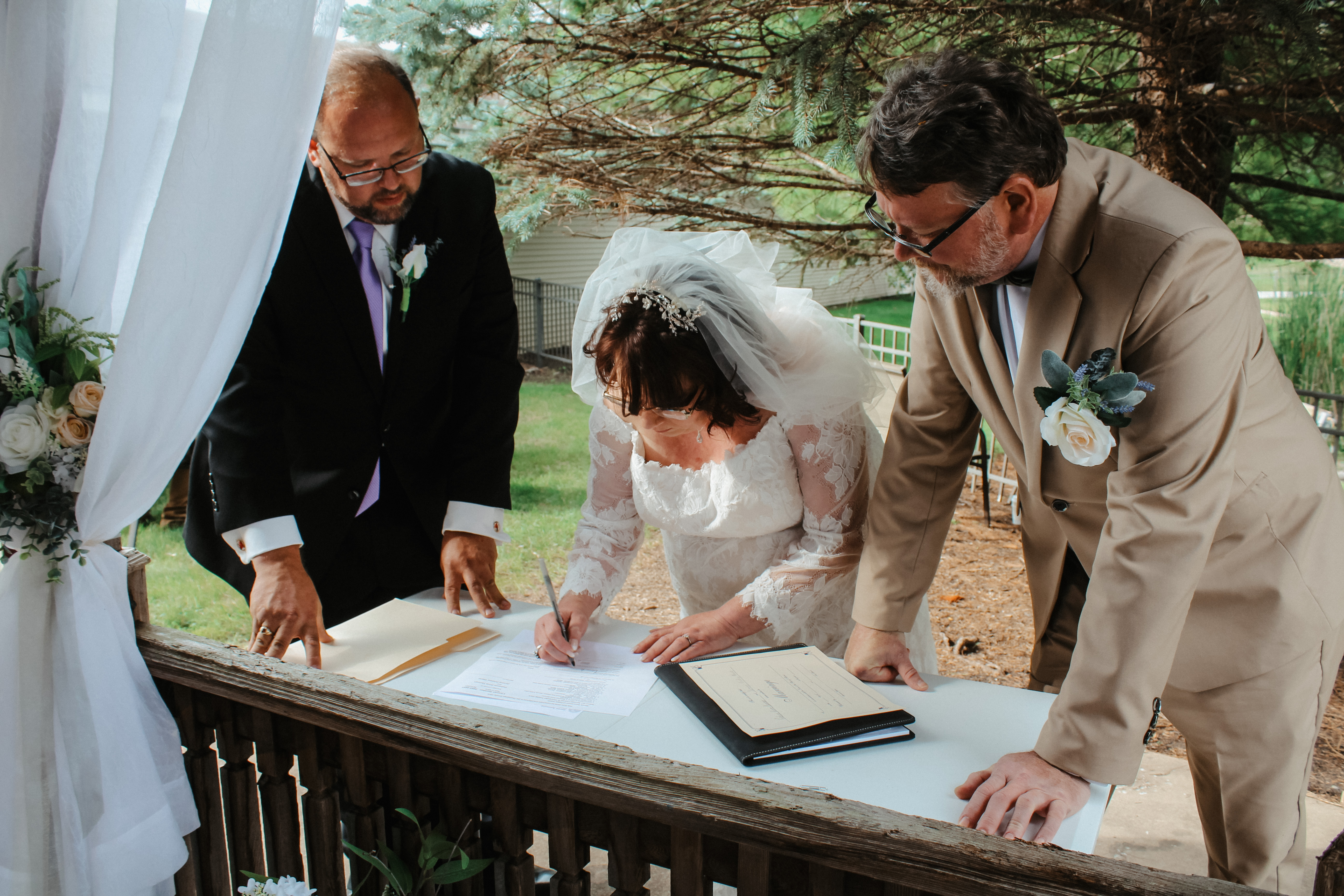 Wedding pictures, Wedding Photography, signing the papers