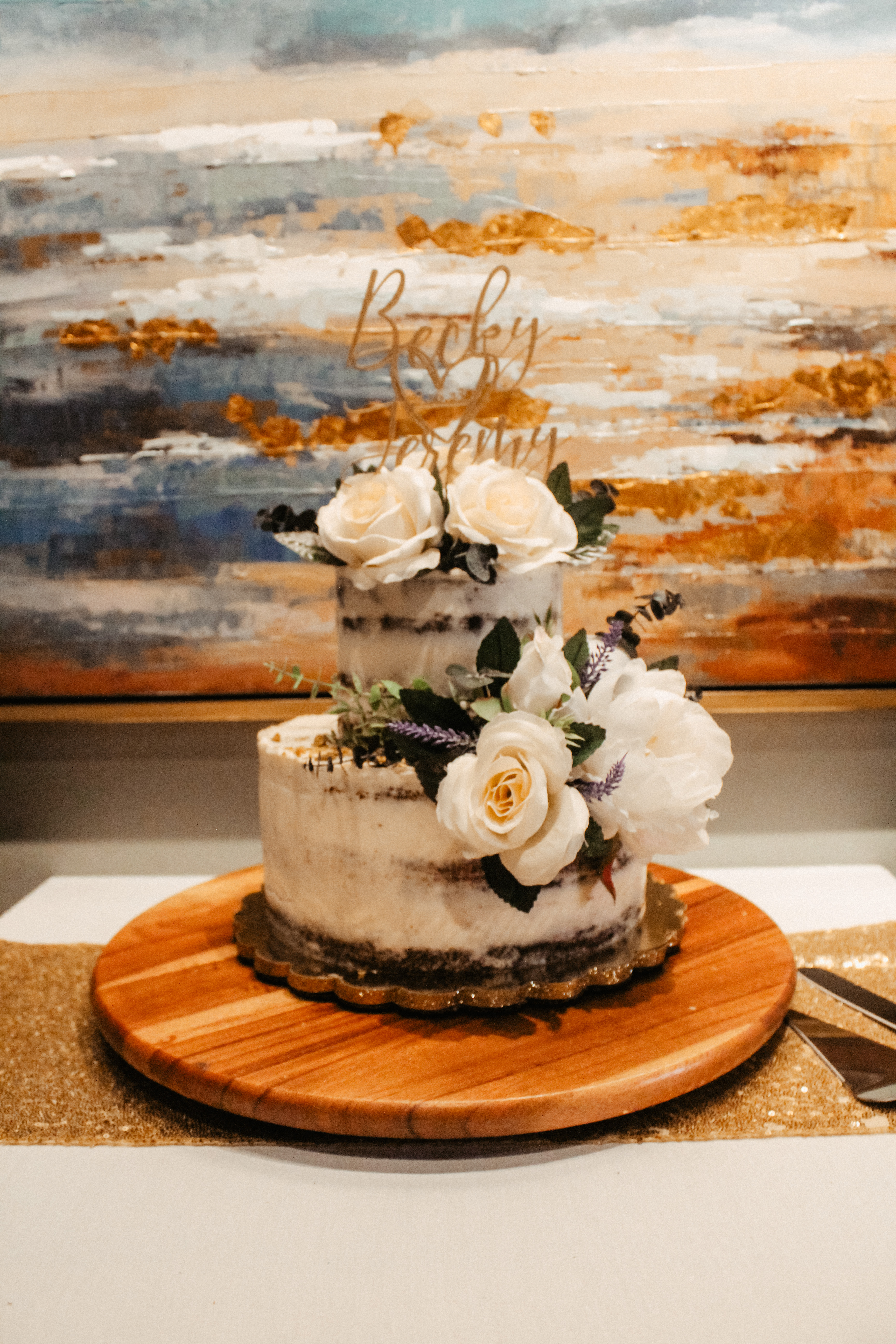 Two-tier wedding cake with floral topper, rustic buttercream finish, Becky and Jeremy topper